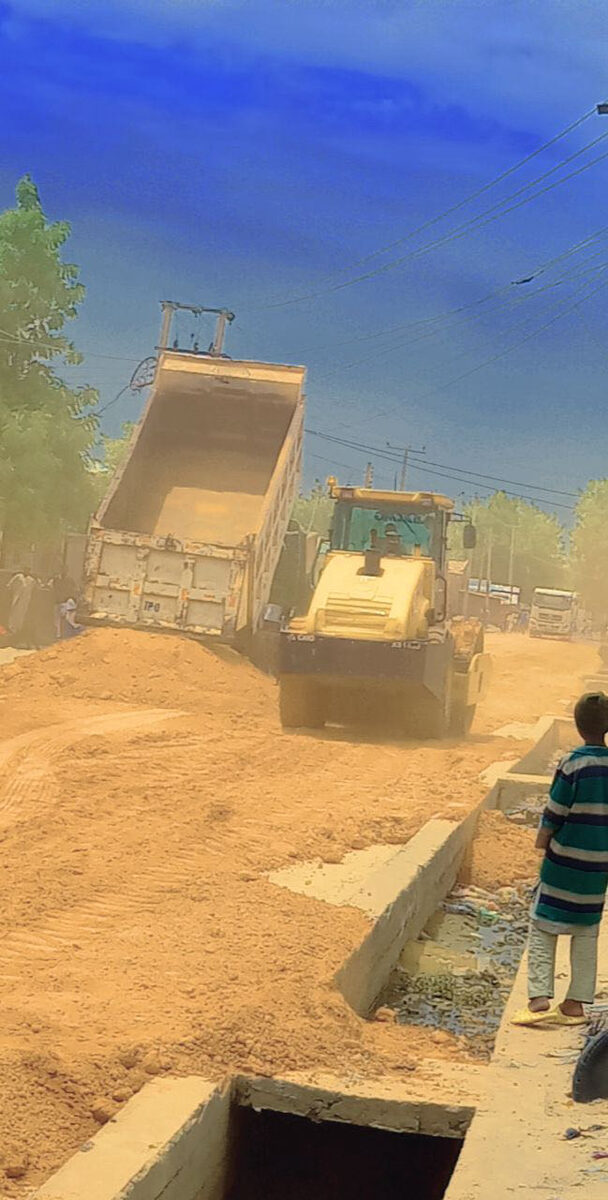 Road earthworks with truck and grader